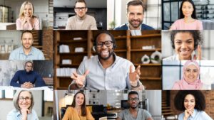 Confident African male business coach holding online webinar, a group of diverse people involved. Online video meeting of multinational work team, video call screen with a many people profiles on it |
