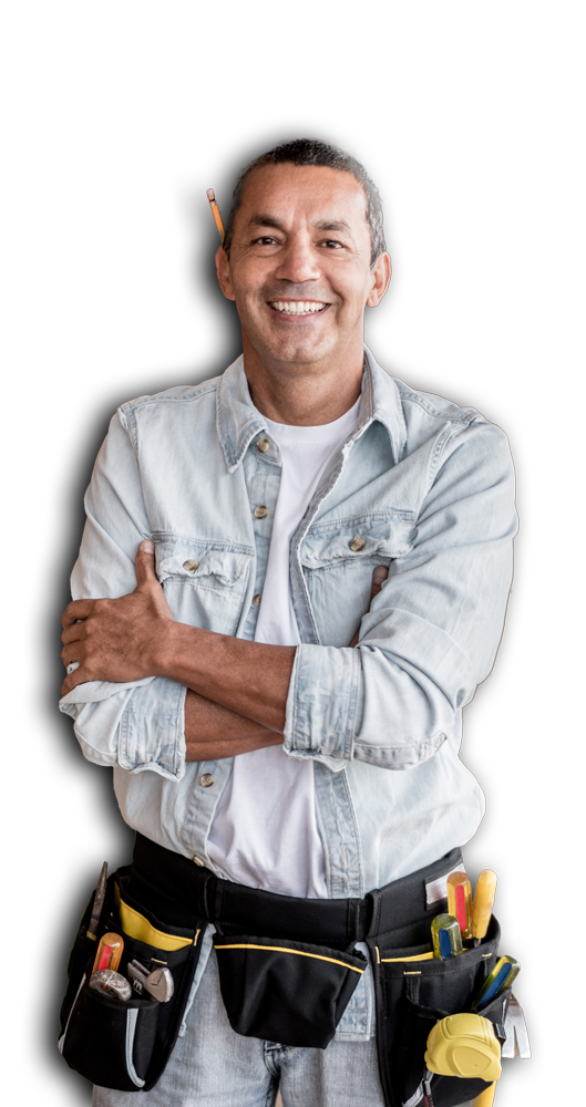 A man wearing a blue shirt and jeans stands confidently, tools secured in his belt, ready for work.